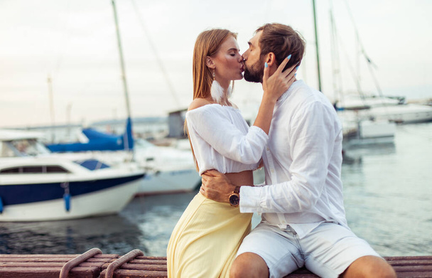 Kissing couple in love in the yacht club. Romantic, love concept - Zdjęcie, obraz