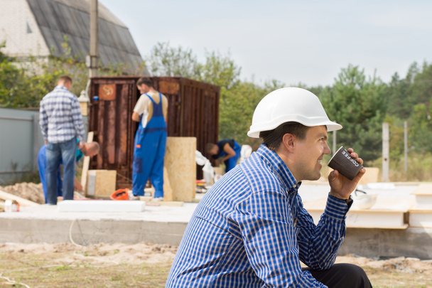 Workman drinking coffee on a building site - Φωτογραφία, εικόνα