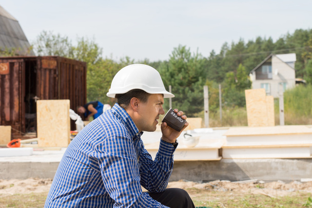 Building contractor taking a coffee break - Фото, изображение