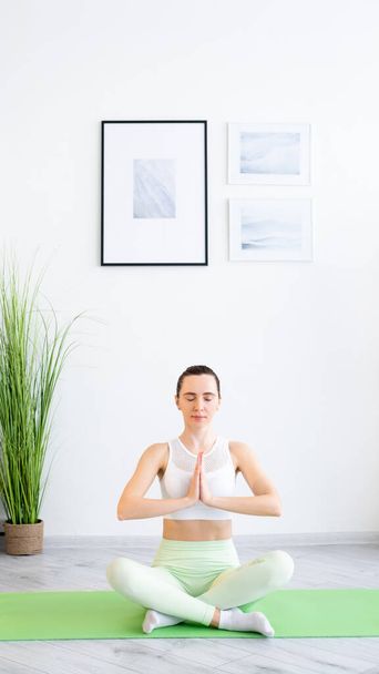 meditating woman yoga practice body wellness home - Zdjęcie, obraz