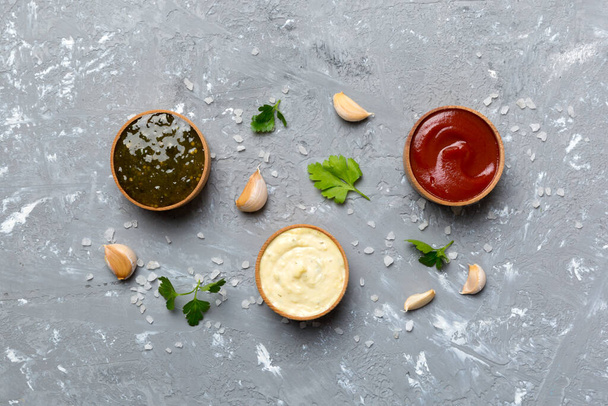Many different sauces and herbs on table, flat lay top view. sauces with spices healthy concept. - Photo, Image