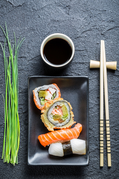 Fresh sushi, dark ceramic and chopstick - Foto, Imagem