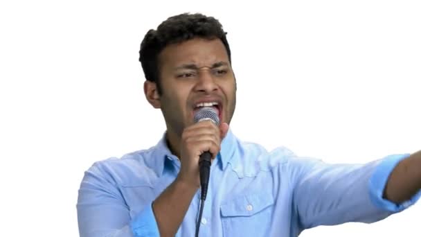 Dark-skinned man singing with microphone. - Footage, Video