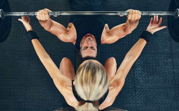 Dont be a chump, you must pump. Shot of a couple working out at the gym. - 写真・画像
