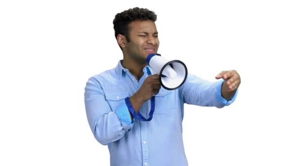 Expressive man talking into megaphone on white background. - Footage, Video