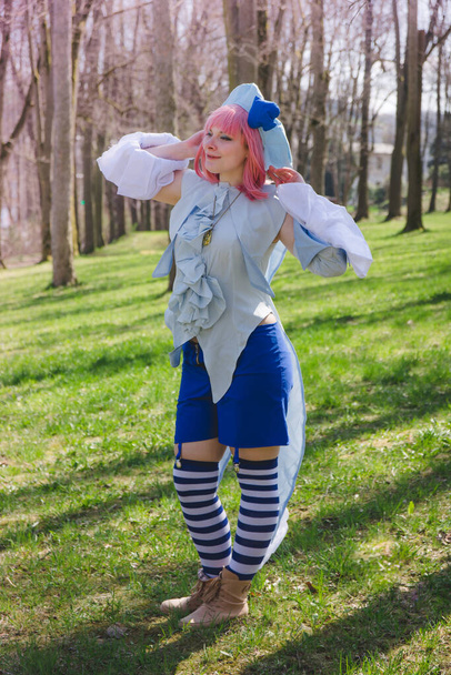 a woman dressed up as an anime character in the forest - Valokuva, kuva