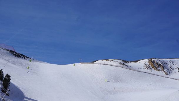 landscapes of the Grandvalira ski resort in the Pyrenees in Andorra on a sunny day in April - Photo, Image