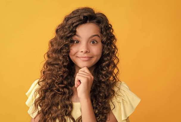 smiling teen girl with long curly hair and perfect skin, beauty - Photo, Image