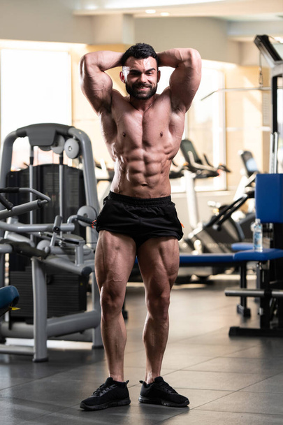 Portrait Of A Young Physically Fit Man Showing His Well Trained Body - Muscular Athletic Bodybuilder Fitness Model Posing After Exercises - Fotoğraf, Görsel