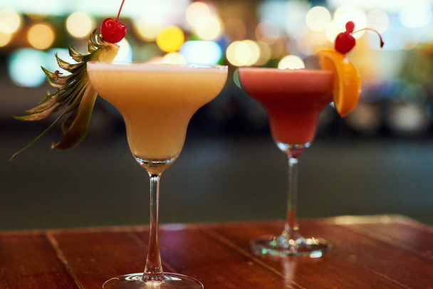Get ready to party. Shot of two cocktails on a table in a bar. - Foto, Imagen