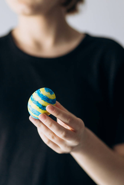 Ukrainian girl holds painted pysanka egg. Easter Egg - Photo, Image