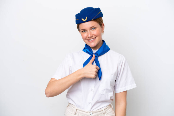 Stewardess des Flugzeugs isoliert auf weißem Hintergrund mit einer Daumen-hoch-Geste - Foto, Bild