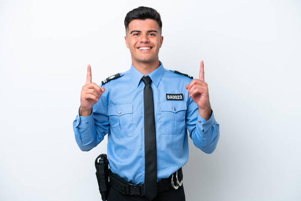 Young police caucasian man isolated on white background pointing up a great idea - Fotografie, Obrázek