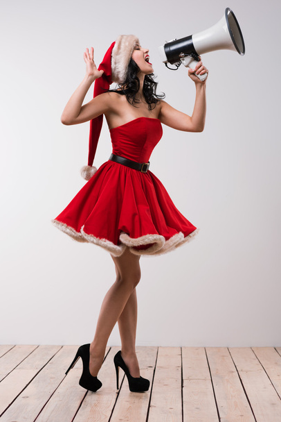 Christmas woman with megaphone - Foto, afbeelding