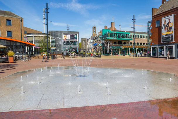 Fountain on the central market square with shops in Emmeloord, Netherlands - Photo, image