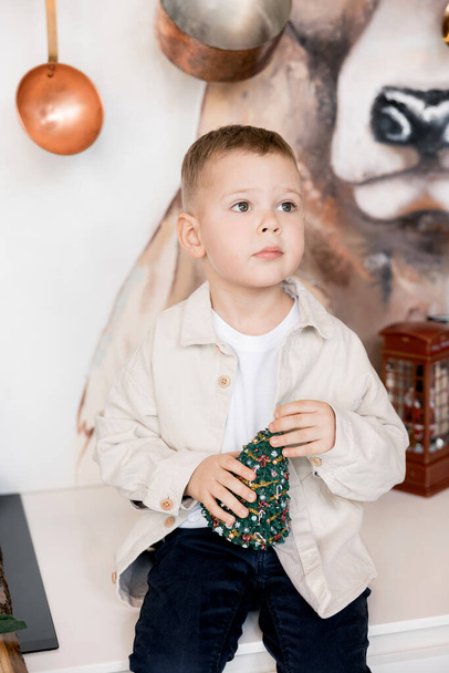 cute little boy with Christmas toy - Zdjęcie, obraz