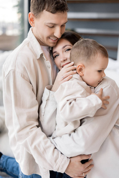 portrait of happy young family with little son at home - Фото, зображення
