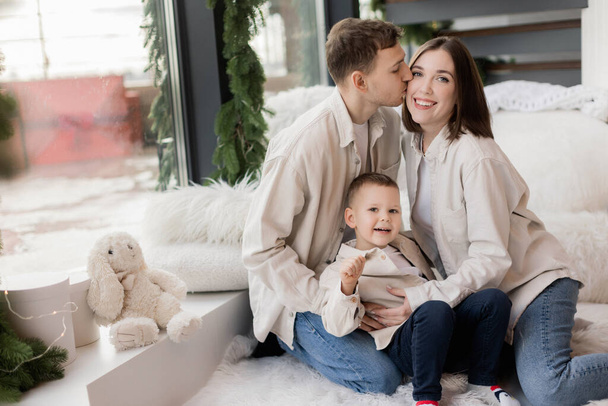 portrait of happy young family with little son at home - Foto, Bild