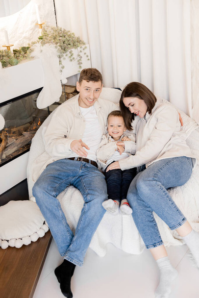 portrait of happy young family with little son at home - Foto, imagen
