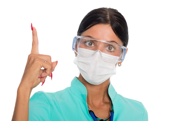 Doctor in a mask with a raised finger - Foto, Imagem