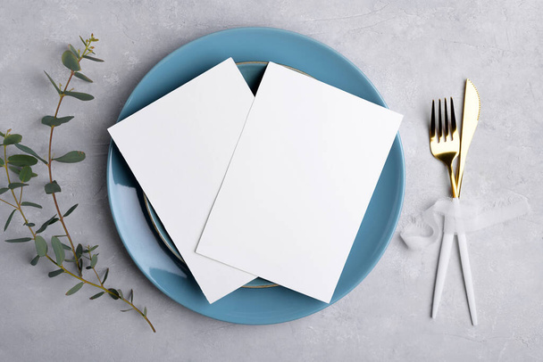 Two Wedding invitation card mockup 5x7 on grey background with eucalyptus, Menu card mockup with table setting - Фото, изображение