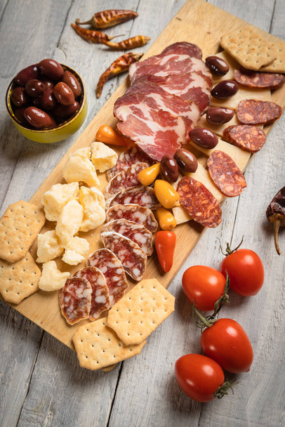 Charcuterie board with various cured meats and sausages - Zdjęcie, obraz
