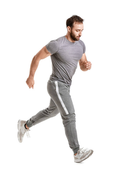 Sporty male runner on white background - Photo, image
