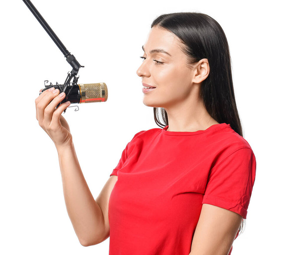 Beautiful woman with professional microphone on white background - Photo, Image