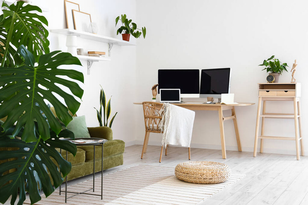 Modern workplace in stylish room interior - Фото, изображение