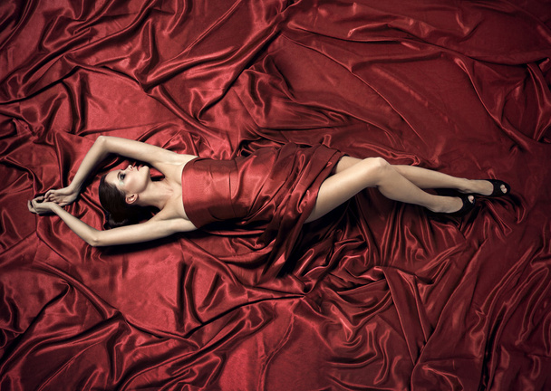 Young beauty woman in red dress. - Fotoğraf, Görsel