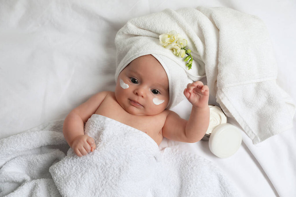 Cute little baby with cream on face, top view - Фото, зображення