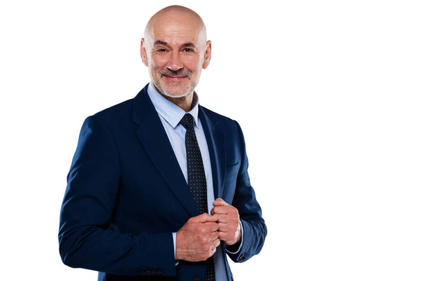 Cropped shot of smiling businessman wearing suit and tie while standing at isolated white background. Copy space. - Valokuva, kuva
