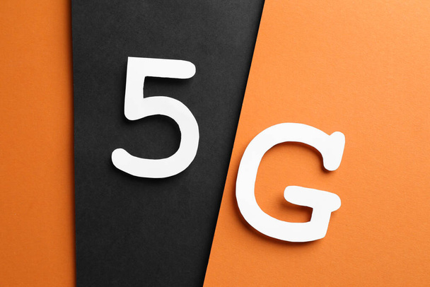 Internet concept. 5G on color background, flat lay - Фото, зображення