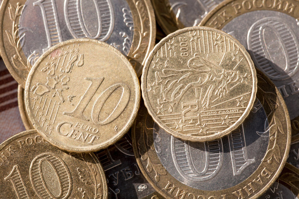 Coin worth ten cents on the euro coins against ten rubles - Photo, Image