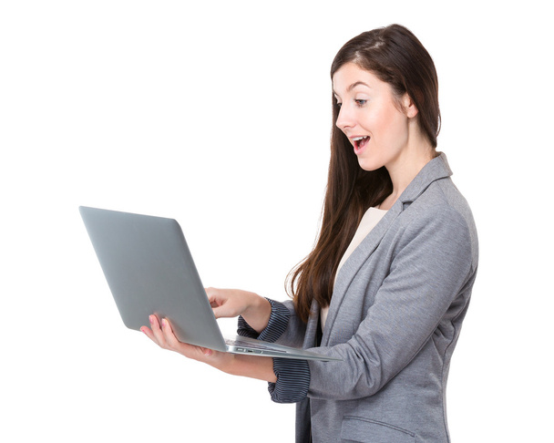Businesswoman using laptop compuer - Fotó, kép