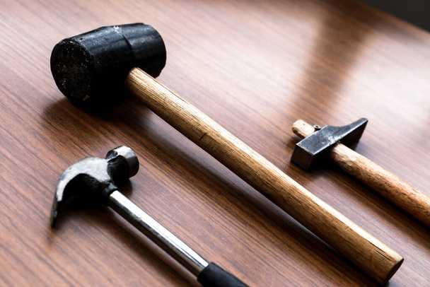 Some tools, a set of hammers with some nails and screws - Фото, изображение