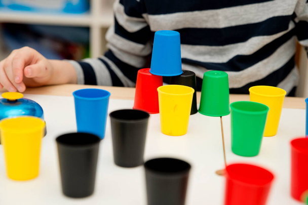 Color cap game. Sorting, counting, building. Children activities. Logical tasks for kids. Concentration and attention, patience, Montessori methodology. pursuit of the goal, strategy, new challenge. - Фото, зображення