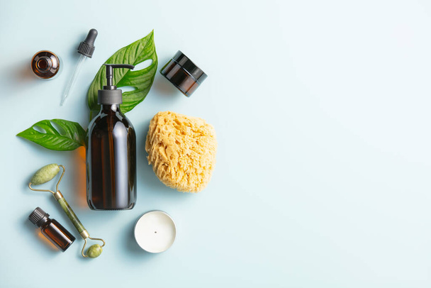 Natural skin care products on blue background, flat lay. - 写真・画像