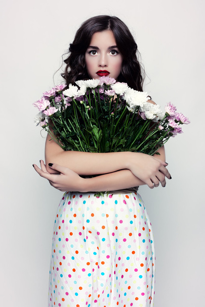 Glamorous portrait of brunette with a dress in peas. - Фото, изображение