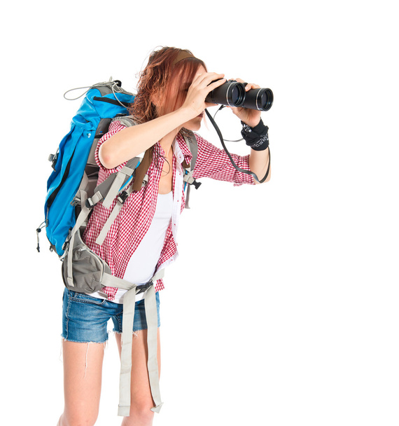 girl looking through binoculars over white background - Foto, imagen