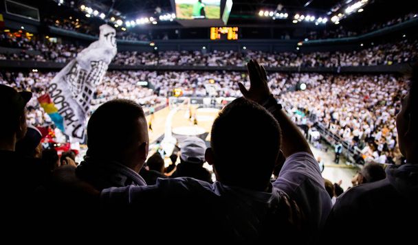 supporters cheering during a basketball game - 写真・画像