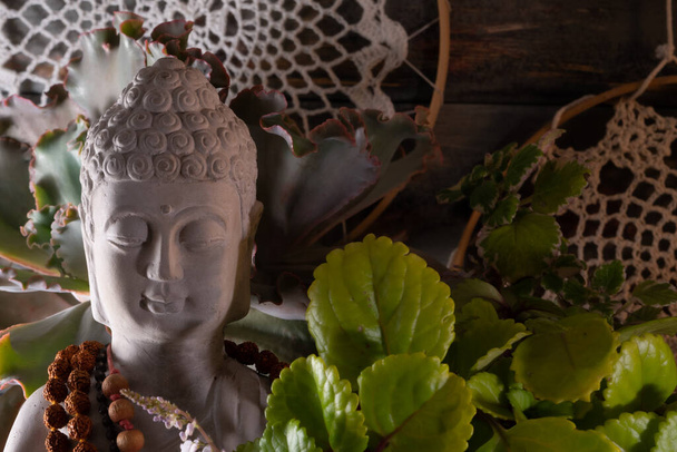 buddha statue image on altar with candles and plants - Fotografie, Obrázek