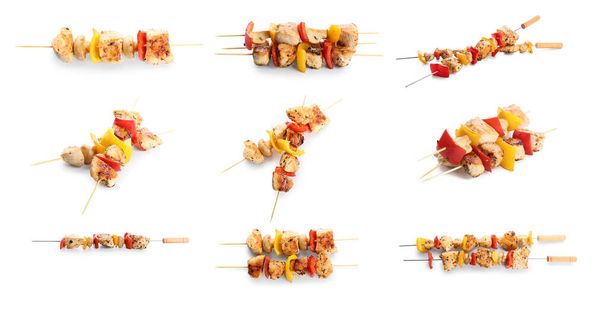 Set of skewers with tasty grilled chicken and vegetables isolated on white  - Photo, Image