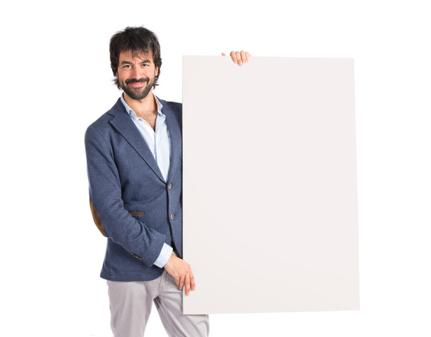 Empresário com cartaz vazio sobre fundo branco idolatrado
  - Foto, Imagem