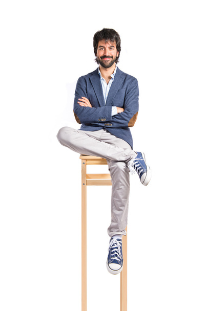 Businessman with his arms crossed over white background   - Foto, afbeelding