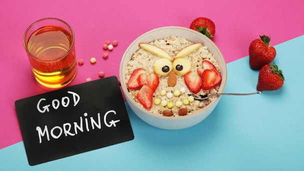 Creative oatmeal breakfast for kids on colourfull background. Healthy breakfast idea. Playful lunch. Top view, flat lay, copy space - Photo, Image