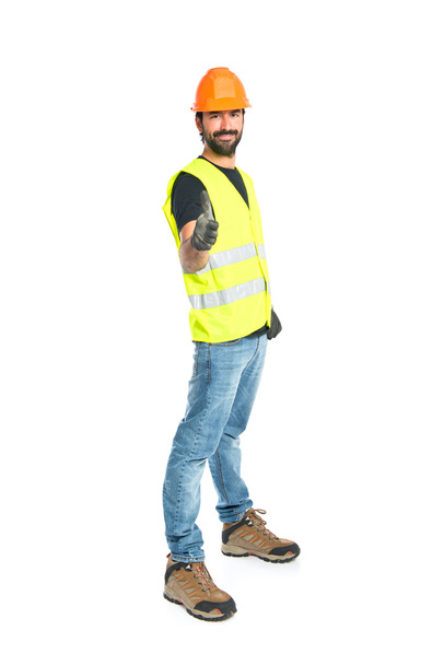 Workman with thumb up over white background - Photo, Image