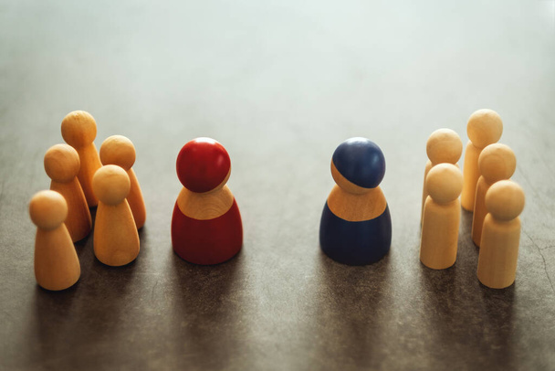 Two different groups of people standing facing to each other for equality and competition in business concept - Photo, Image