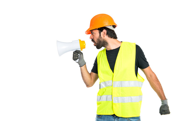 Workman shouting over isolated white background - 写真・画像