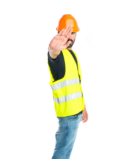 Workman faisant stop signe sur fond blanc
 - Photo, image
